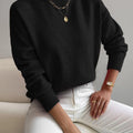 Women's relaxed mock neck sweater with dropped shoulders and ribbed cuffs