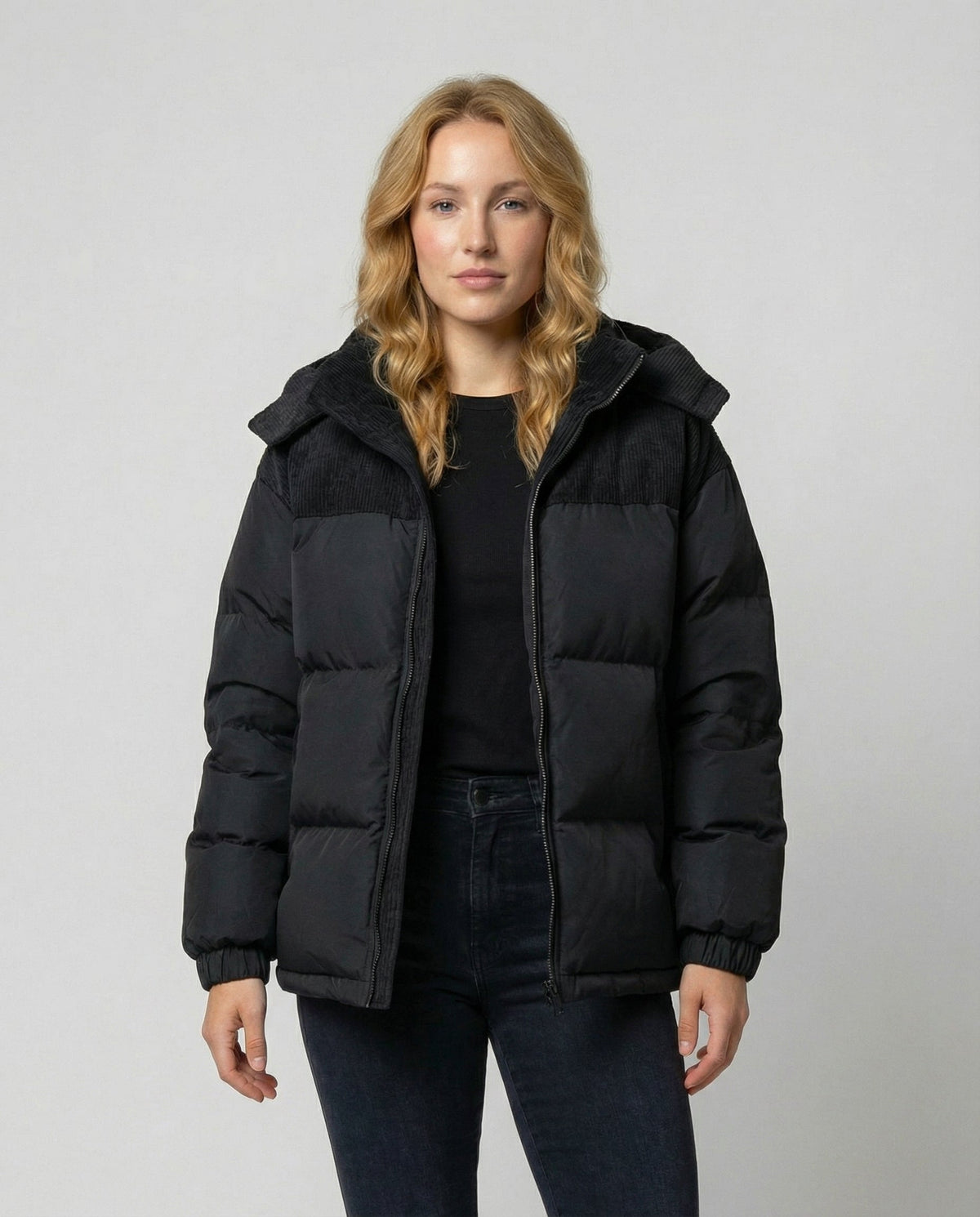 Women's black hooded quilted winter coat with corduroy shoulder yoke