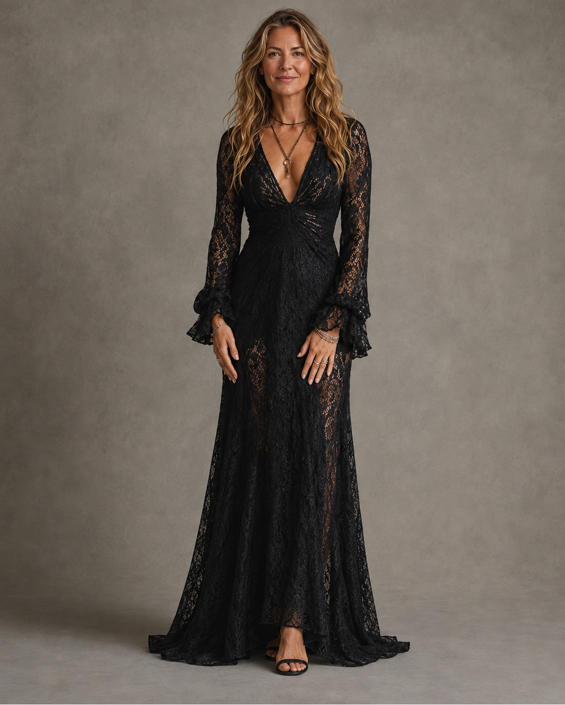 Black lace long sleeve maxi dress with plunging V-neck and ruffled bell sleeves