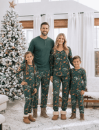 Family wearing matching green safari animal print Christmas pajamas - view 2