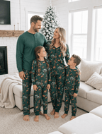 Family wearing matching green safari animal print Christmas pajamas - view 3