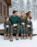 Family wearing matching green safari animal print Christmas pajamas - view 4
