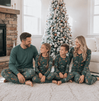 Family wearing matching green safari animal print Christmas pajamas - view 8