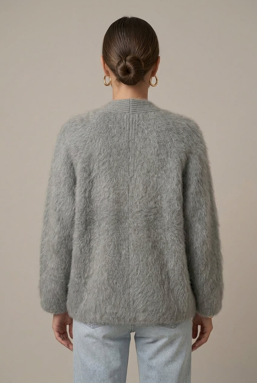 Woman wearing a fluffy open front cardigan in brushed knit over a cami and jeans - view 3