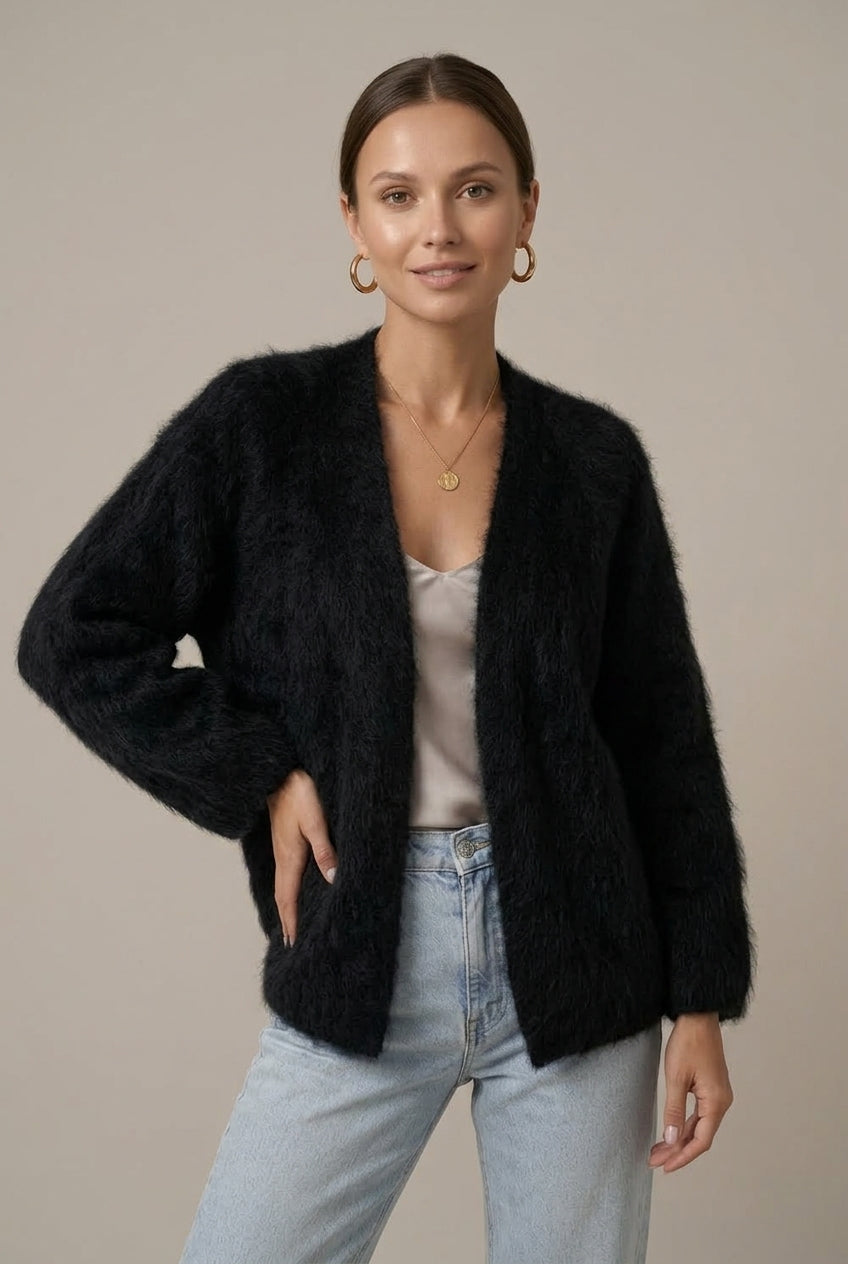 Woman wearing a fluffy open front cardigan in brushed knit over a cami and jeans - view 4