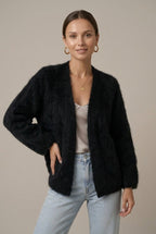 Woman wearing a fluffy open front cardigan in brushed knit over a cami and jeans - view 4