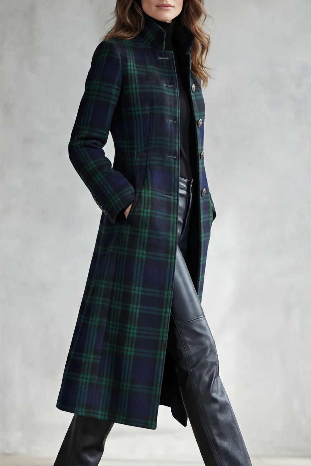 Woman wearing a long navy and green plaid stand collar coat with metal buttons - view 3