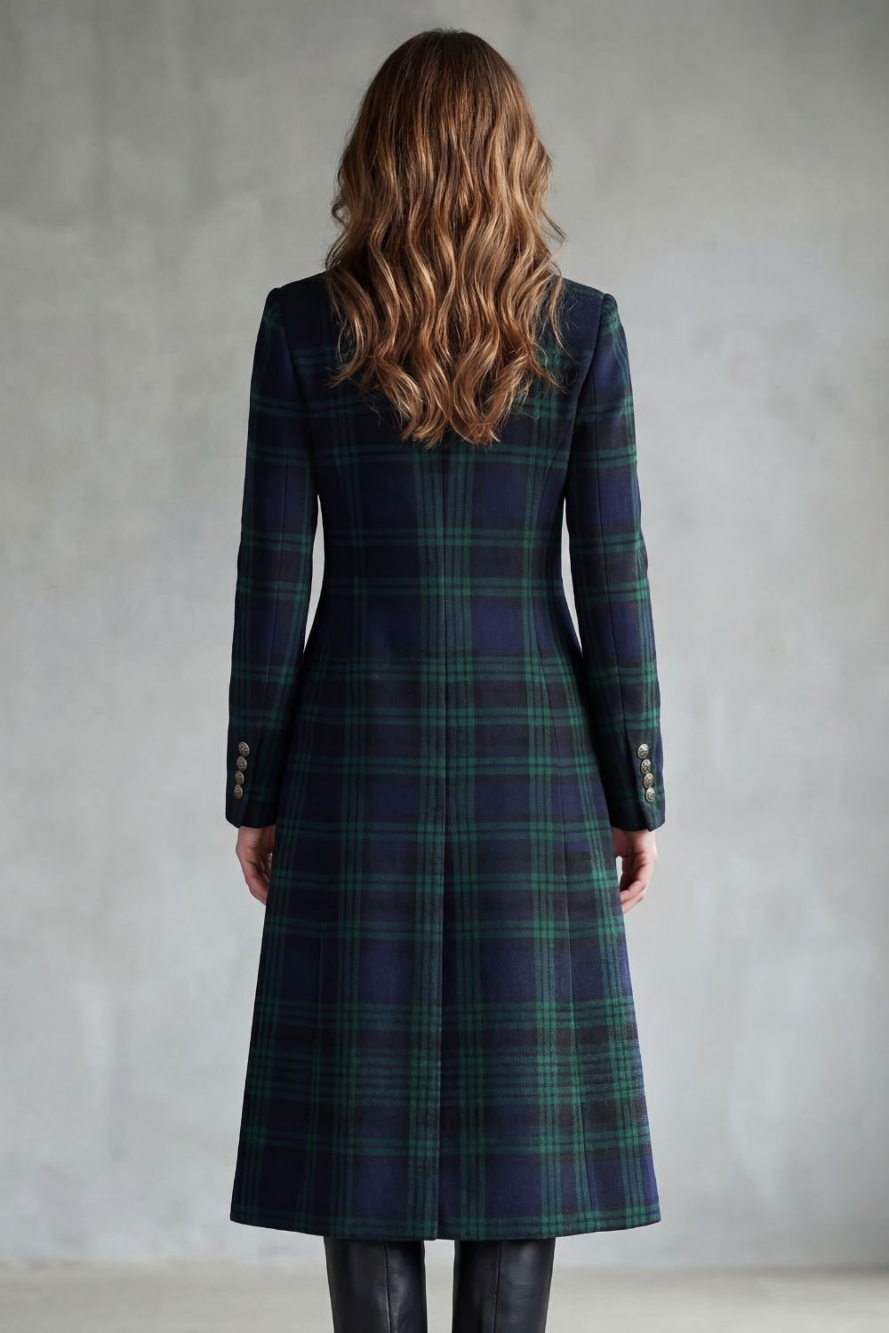 Woman wearing a long navy and green plaid stand collar coat with metal buttons - view 4