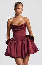 Light pink strapless satin mini dress with draped neckline, flared skirt and oversized back bow - view 13