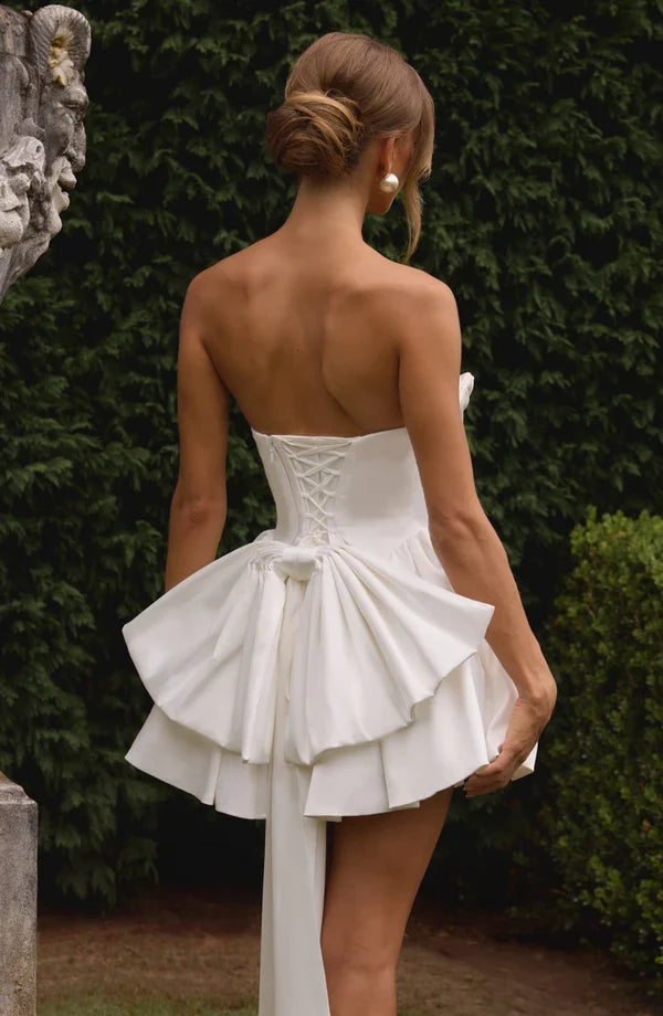 Light pink strapless satin mini dress with draped neckline, flared skirt and oversized back bow - view 23