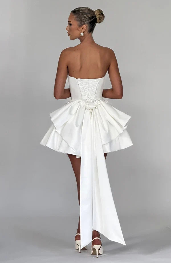 Light pink strapless satin mini dress with draped neckline, flared skirt and oversized back bow - view 25
