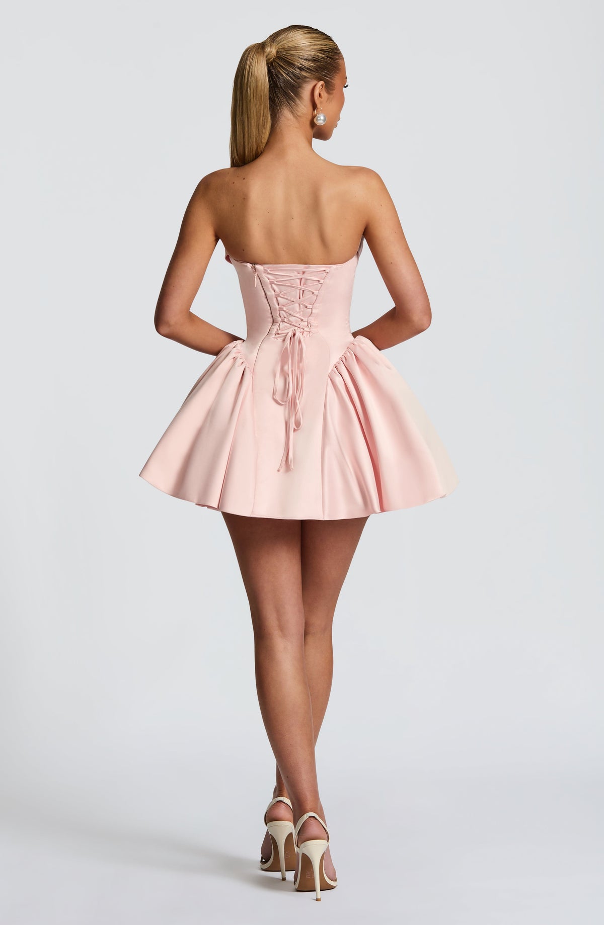 Light pink strapless satin mini dress with draped neckline, flared skirt and oversized back bow - view 5