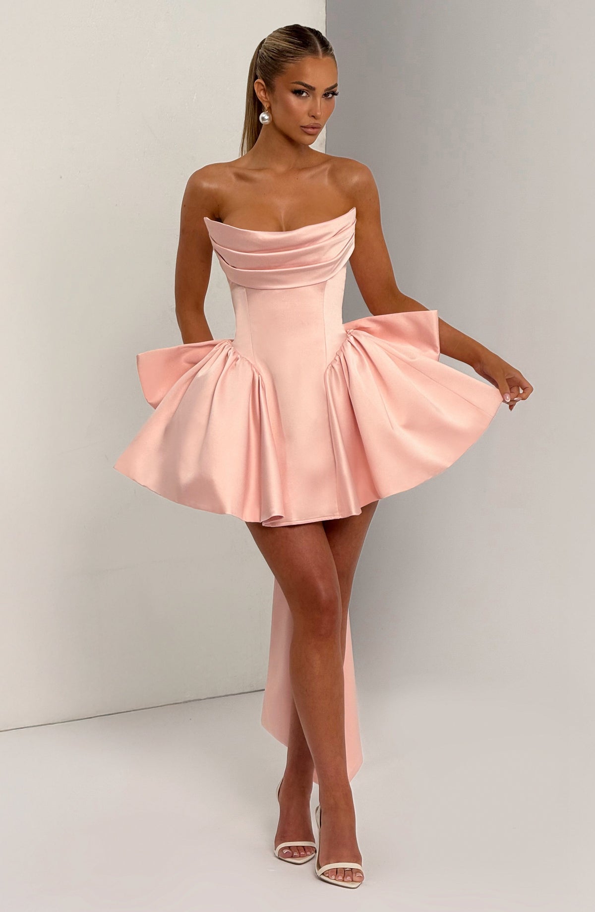 Light pink strapless satin mini dress with draped neckline, flared skirt and oversized back bow - view 6