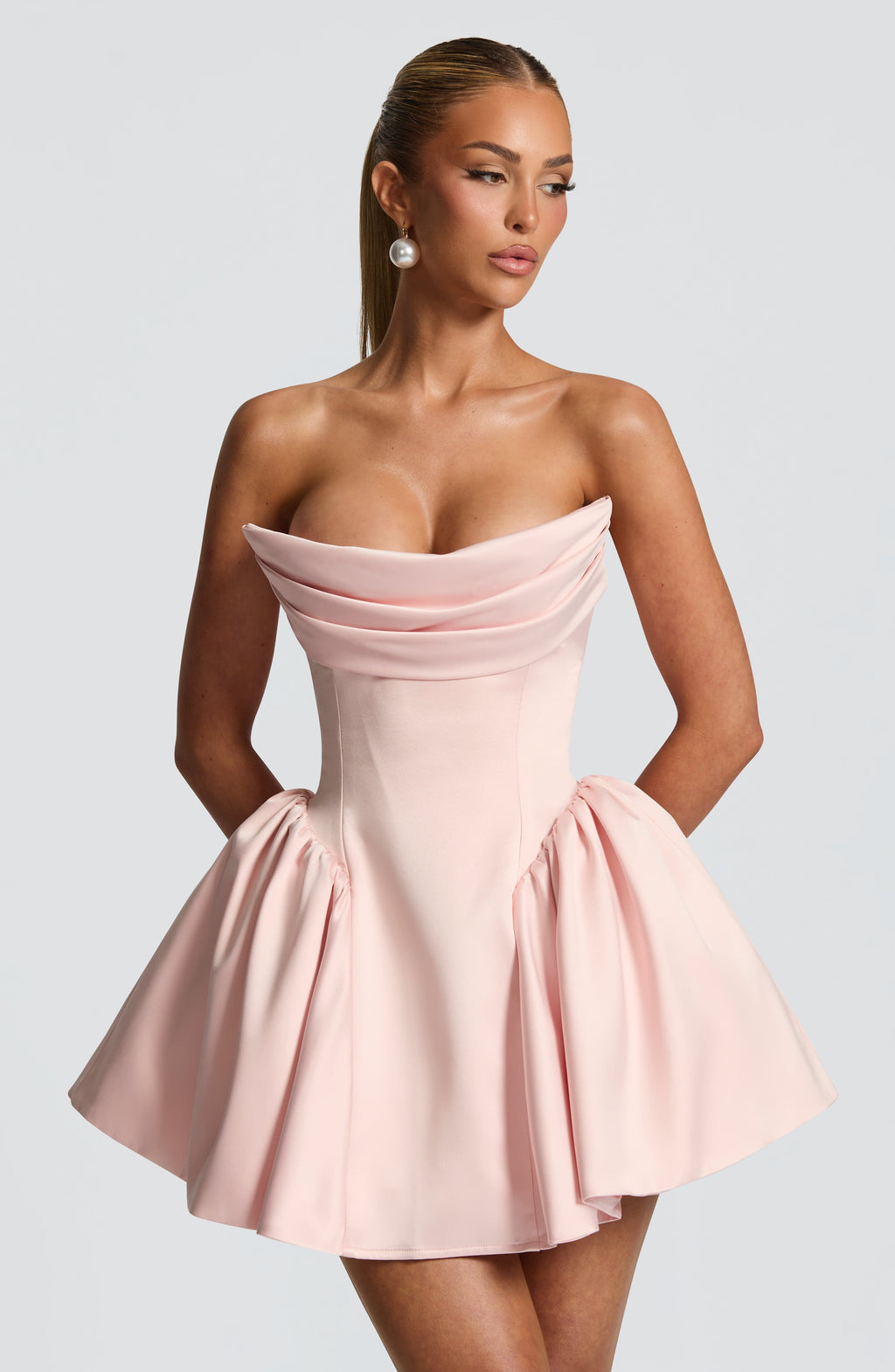 Light pink strapless satin mini dress with draped neckline, flared skirt and oversized back bow - view 7