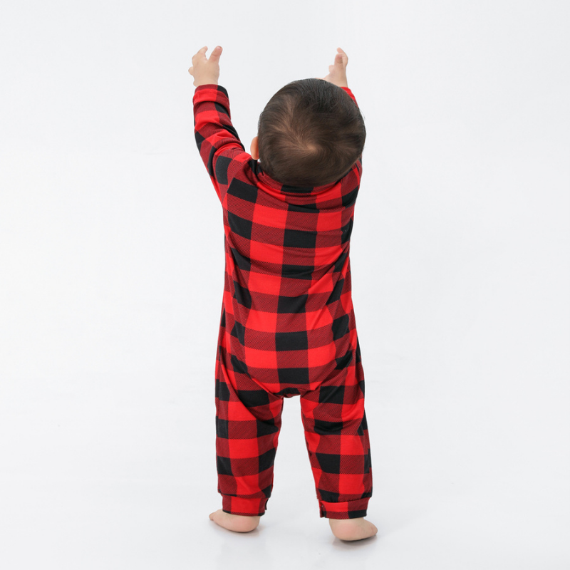 Family wearing matching red and black buffalo plaid Christmas pajamas - view 13