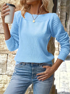 Women's knit pullover sweater with openwork sleeves and ribbed boat neckline