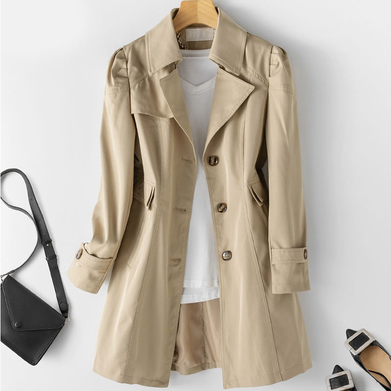 Women's fitted single-breasted trench coat with puff shoulders and notched lapels