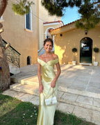 Woman wearing an off shoulder satin maxi wedding guest dress - view 3