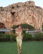 Woman wearing an off shoulder satin maxi wedding guest dress - view 5