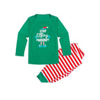 Family in matching green elf graphic tops and red and white striped Christmas pajama pants - view 10