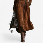 Woman wearing a long double breasted suede-look trench coat with contrast piping and flap pockets - view 3