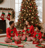 Matching family Christmas pajamas with red elf graphic top and red and white striped pants - view 2