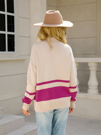 Woman wearing a relaxed colorblock quarter zip knit sweater with ring-pull half zip and ribbed cuffs - view 12