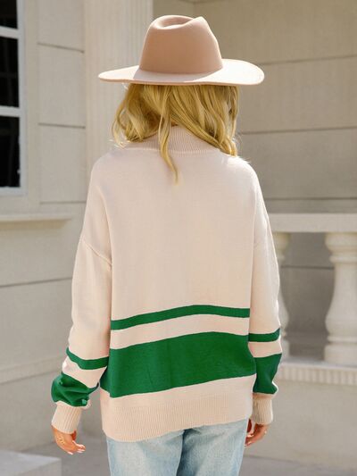 Woman wearing a relaxed colorblock quarter zip knit sweater with ring-pull half zip and ribbed cuffs - view 6