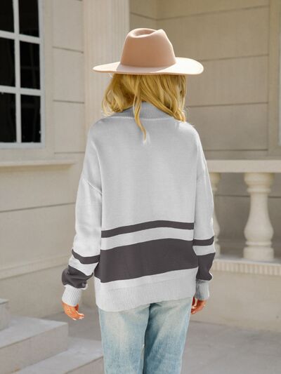 Woman wearing a relaxed colorblock quarter zip knit sweater with ring-pull half zip and ribbed cuffs - view 8