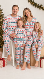 Family wearing matching Fair Isle Christmas pajamas with reindeer and snowflake print