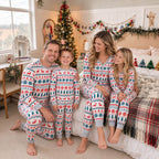 Family wearing matching Fair Isle Christmas pajamas with reindeer and snowflake print - view 20