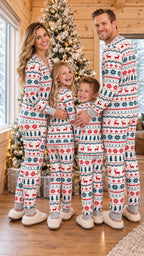 Family wearing matching Fair Isle Christmas pajamas with reindeer and snowflake print - view 3
