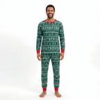 Family wearing matching green Christmas tree print pajamas with red cuffs - view 12