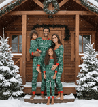Family wearing matching green Christmas tree print pajamas with red cuffs - view 14