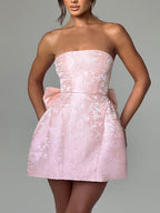 Strapless floral jacquard mini cocktail dress with oversized back bow and A-line skirt