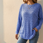 Women's oversized blue ribbed knit sweater with crew neck and curved tunic hem