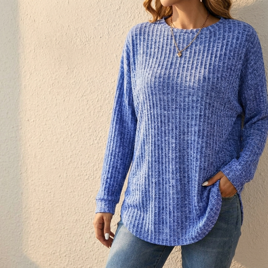 Women's oversized blue ribbed knit sweater with crew neck and curved tunic hem
