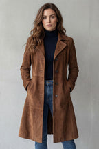 Woman wearing a longline faux suede coat with notched lapels and button front, styled with a turtleneck and jeans - view 2