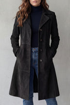 Woman wearing a longline faux suede coat with notched lapels and button front, styled with a turtleneck and jeans - view 4