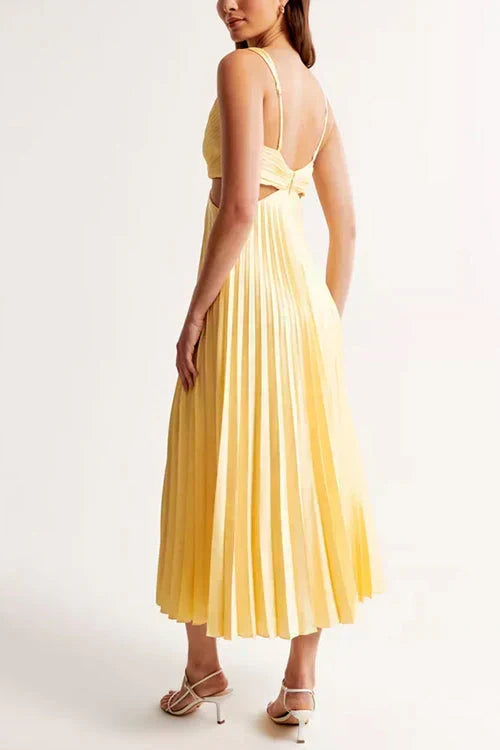 Woman wearing a pleated A-line dress with V-neck ruched bodice and waist cutouts - view 7