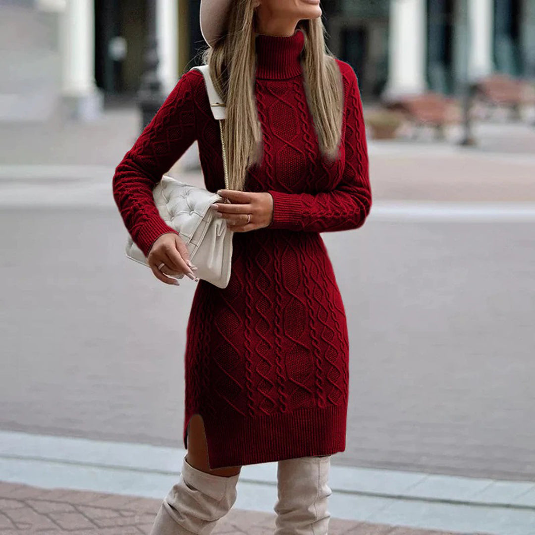 Women turtleneck dress in cable knit with long sleeves, ribbed hem and side slit, worn with tall boots