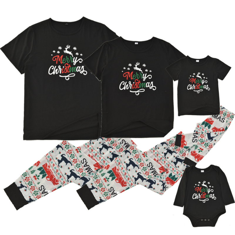 Family wearing matching black Merry Christmas tees and reindeer print jogger pajamas by a Christmas tree - view 6