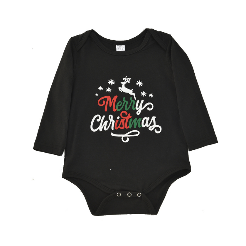 Family wearing matching black Merry Christmas tees and reindeer print jogger pajamas by a Christmas tree - view 7