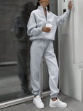 Matching gray half zip pullover and joggers sweat set