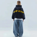 Oversized graphic fleece hoodie with yellow back print and kangaroo pocket