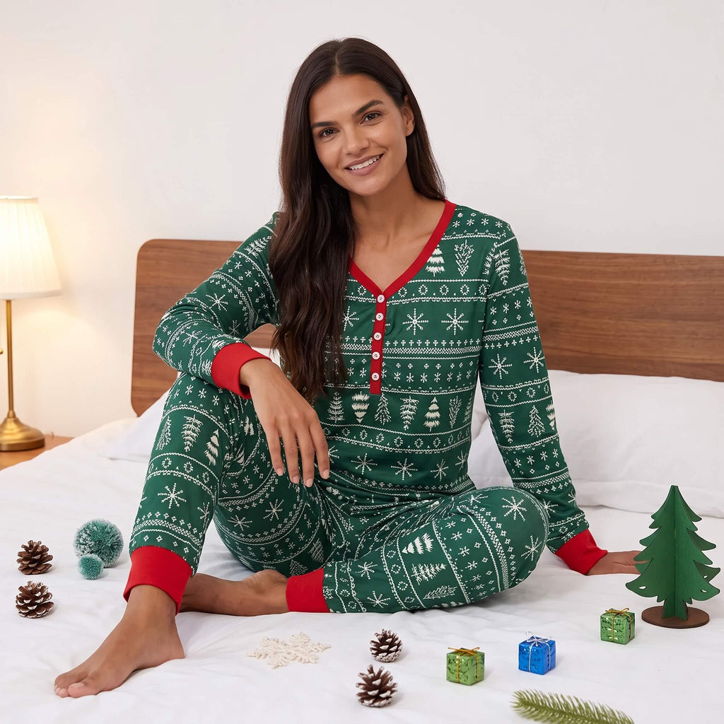 Matching family Christmas pajamas in green with white tree and snowflake print and red cuffs - view 13