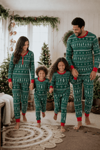 Matching family Christmas pajamas in green with white tree and snowflake print and red cuffs - view 3