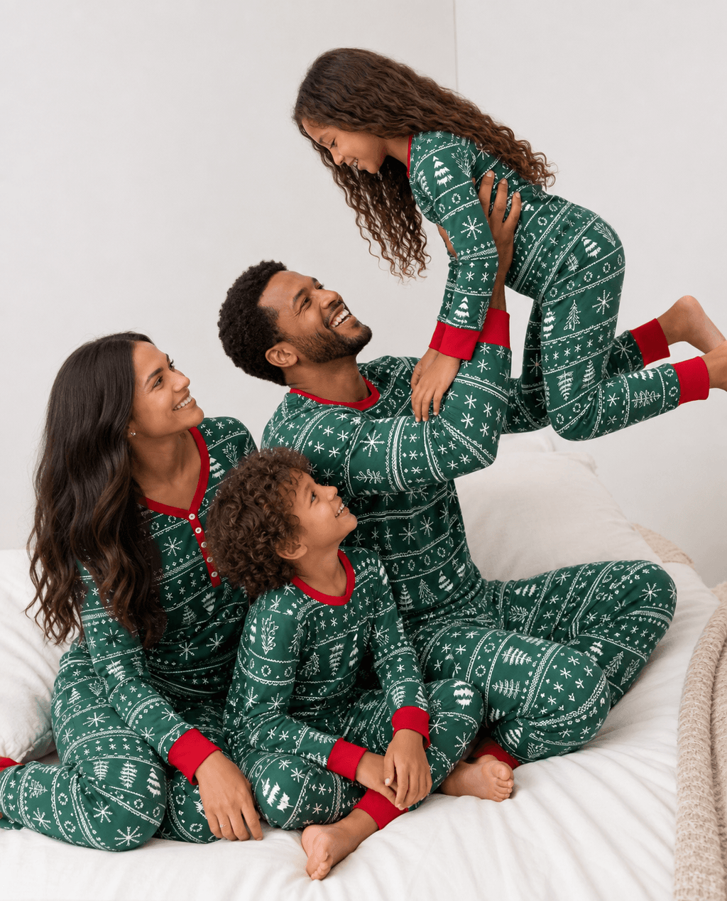 Matching family Christmas pajamas in green with white tree and snowflake print and red cuffs - view 4