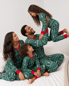 Matching family Christmas pajamas in green with white tree and snowflake print and red cuffs - view 4