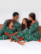 Matching family Christmas pajamas in green with white tree and snowflake print and red cuffs - view 6